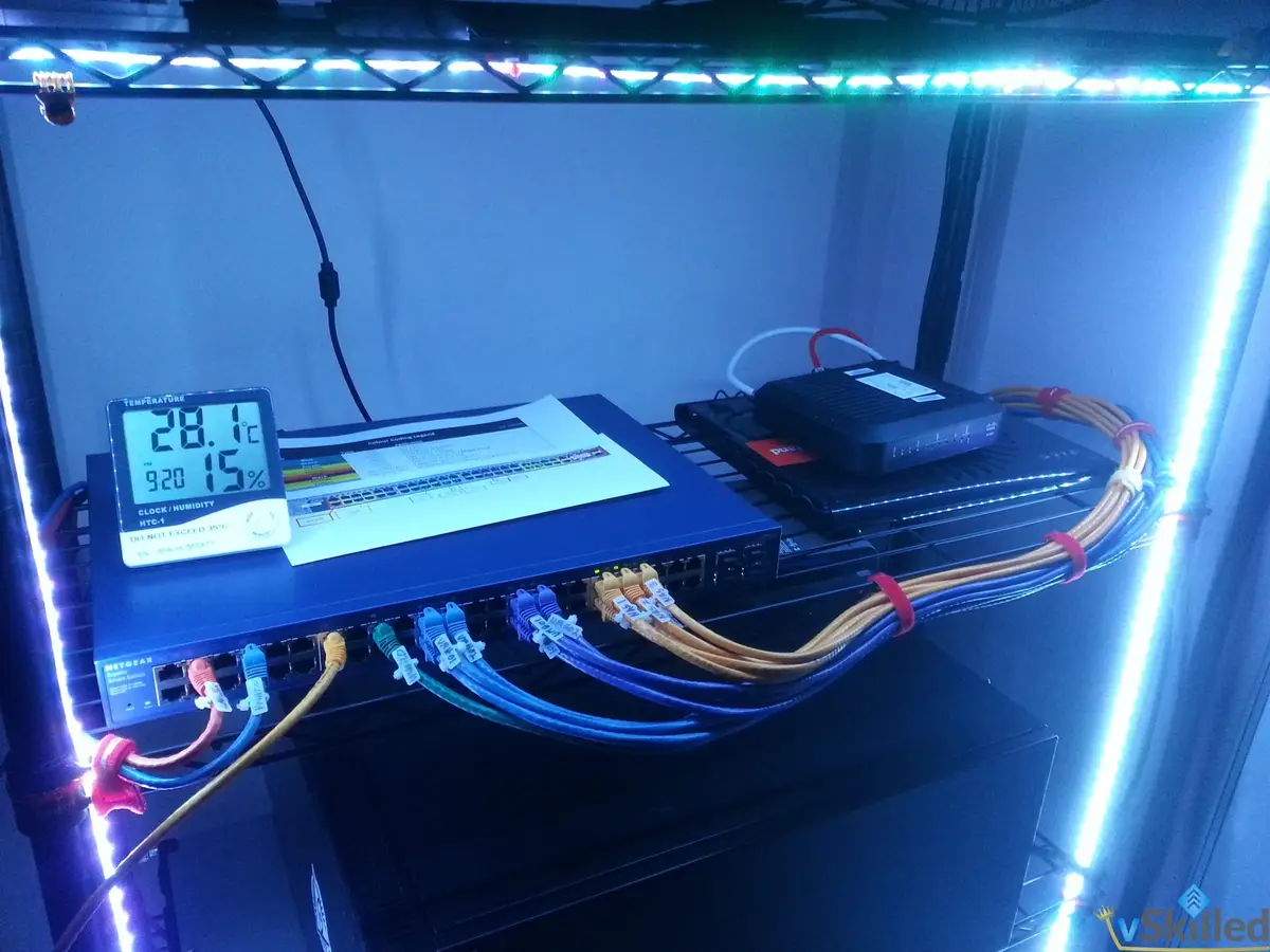 Home lab switch and network equipment illuminated by blue LED strips