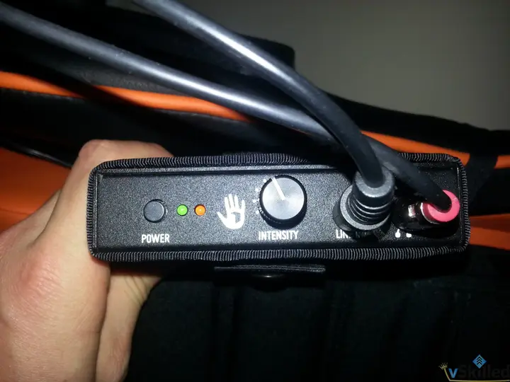 SubPac controller with intensity knob, power lights and audio connections