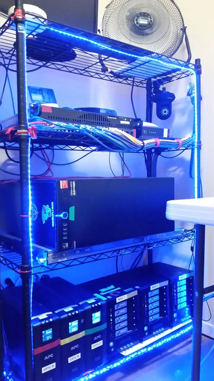 Rebuilt home lab rack with networking, servers, storage and UPS batteries