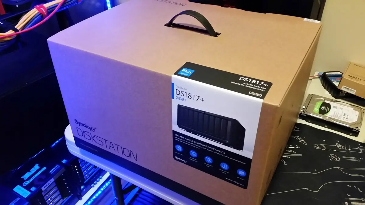 Boxed Synology DiskStation DS1817+ beside the home lab rack