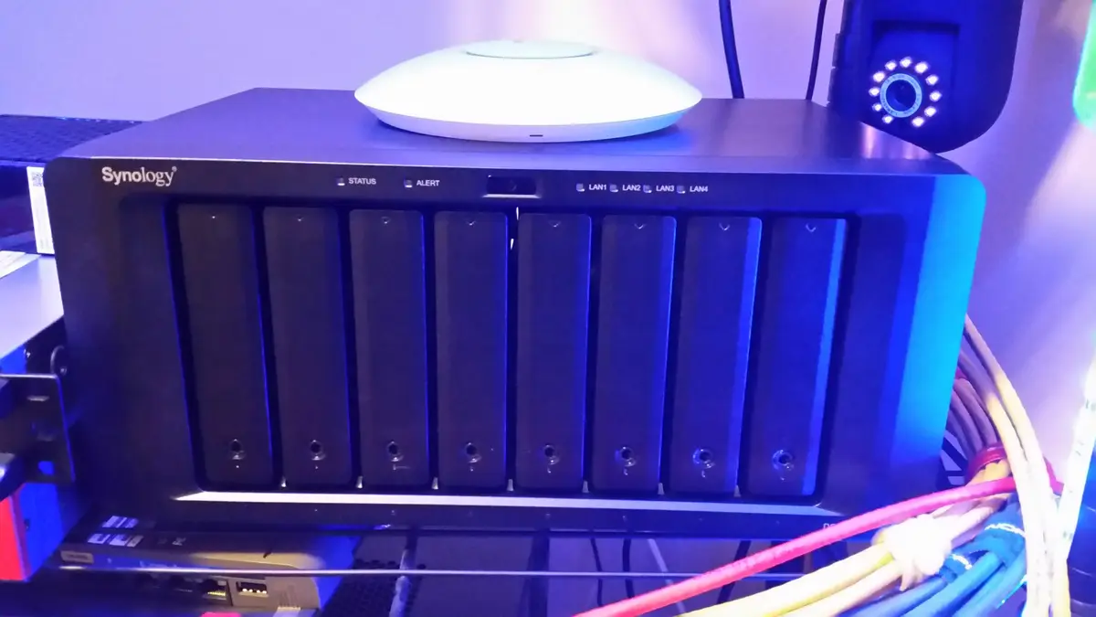 Eight drive bays below a wireless access point on the network shelf