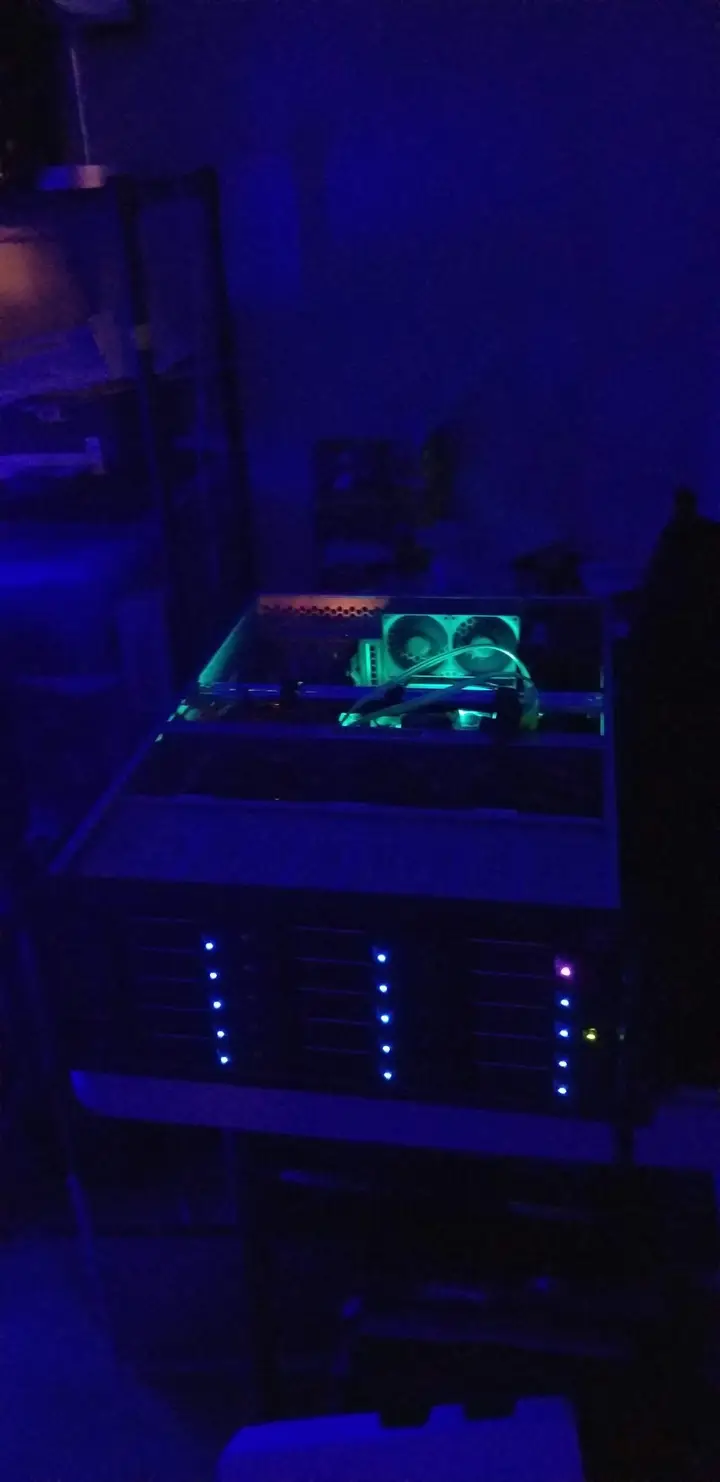 Zion storage server running with its case open and blue lighting