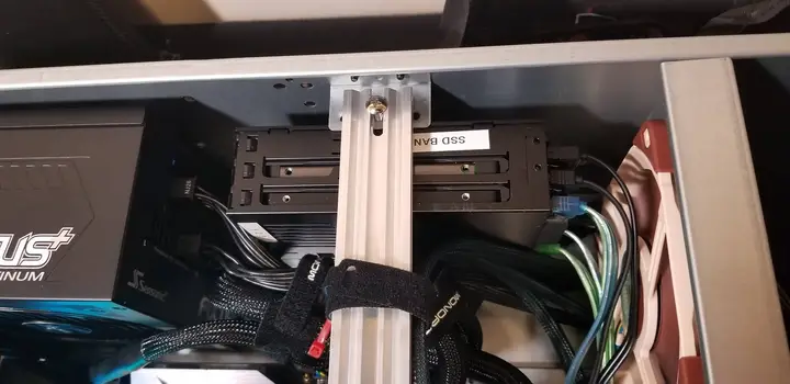 SSD cage mounted inside the server beside the chassis crossbar and bundled cables