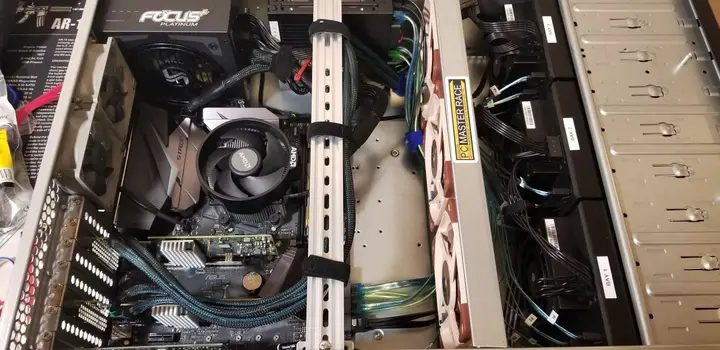 Inside Zion showing the CPU cooler, fan wall, power supply and cable routing