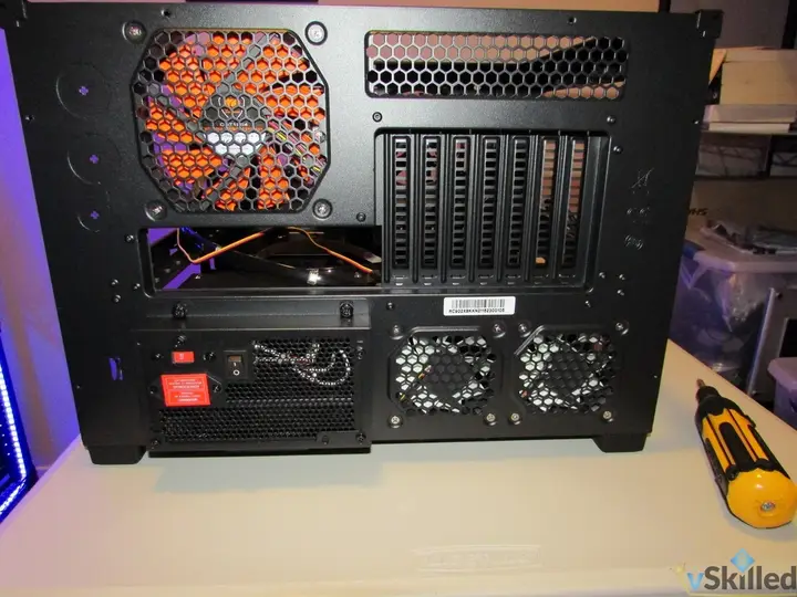 Rear of the HAF XB case showing its fan, expansion slots and power supply