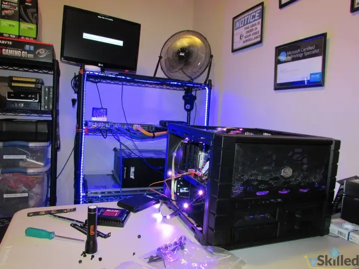 Partially assembled ESXi server on the workbench beside the home lab rack