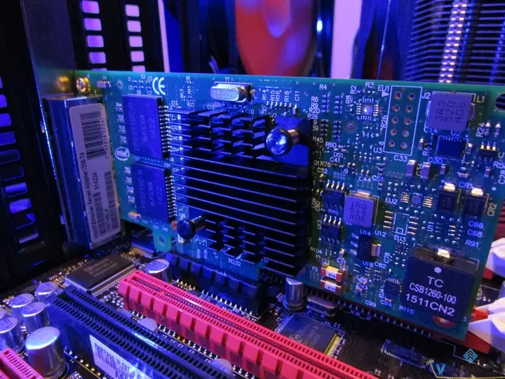 PCIe network adapter installed beside the motherboard expansion slots