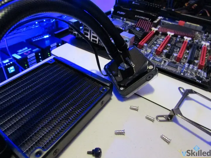 Close-up of the liquid cooler radiator, pump and mounting screws