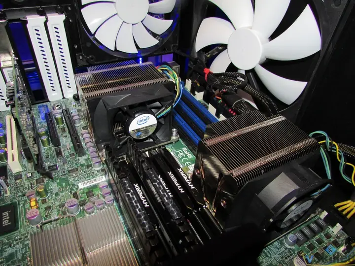 Two CPU coolers and large case fans inside the Supermicro server