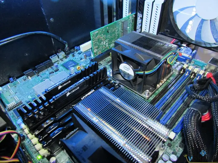 Inside VMH02 showing two CPU coolers, memory and network adapters