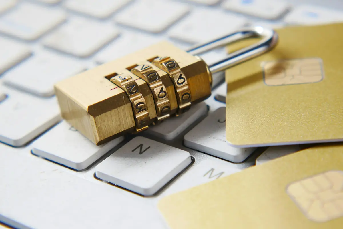 Combination padlock resting on a white computer keyboard