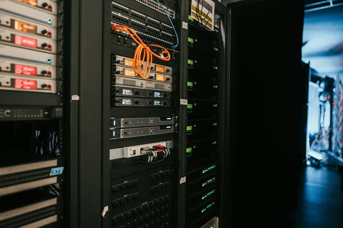 Server cabinets with equipment and orange patch cables