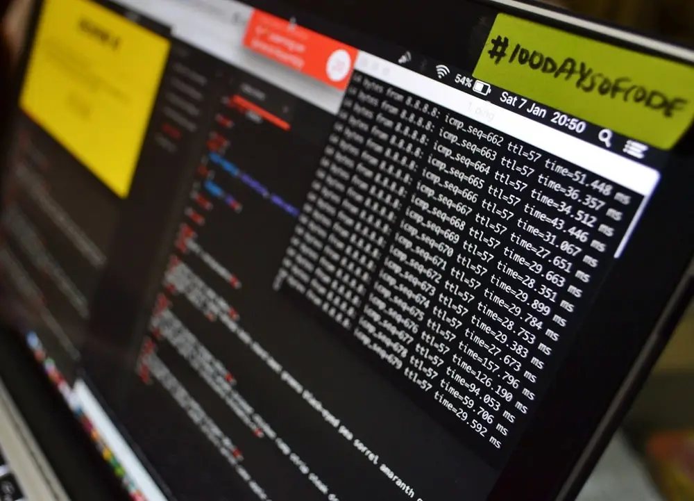 Computer monitor showing terminal output and code