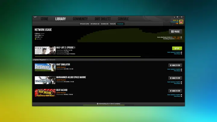One game is downloading while three others wait in the queue.