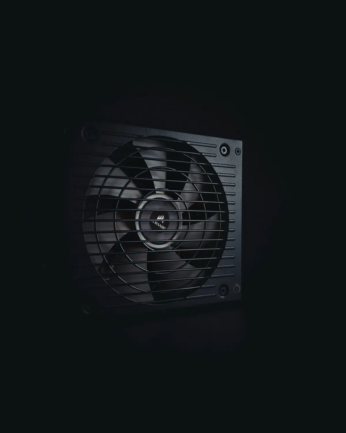 Cooling fan behind the grille of a computer power supply