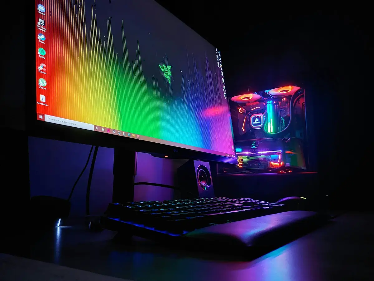 Desktop gaming computer and monitor with multicoloured lighting
