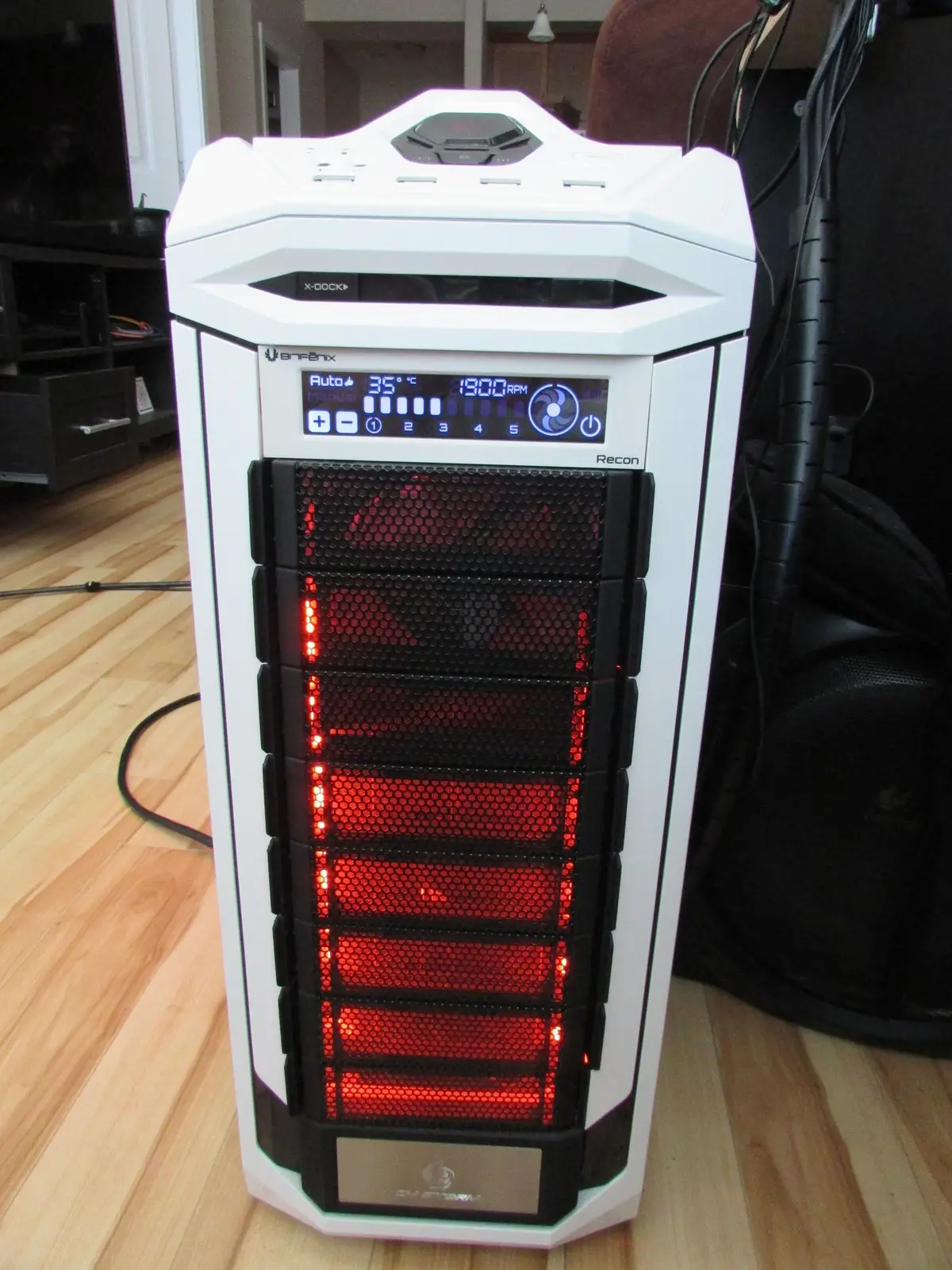White Cooler Master Stryker gaming PC with red-lit front fans