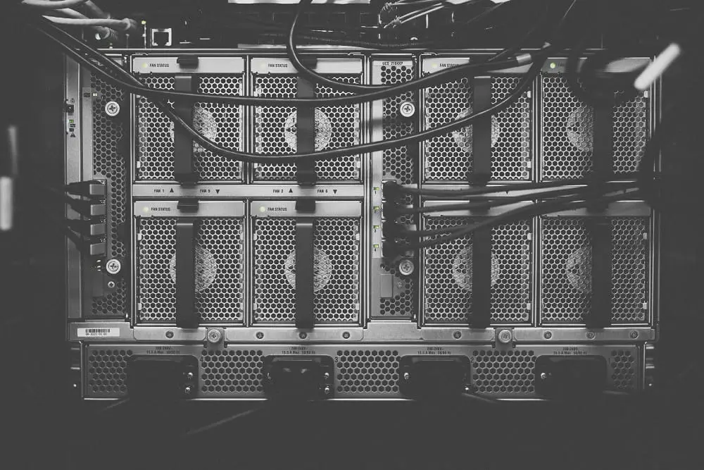 Server chassis and cables inside an equipment rack