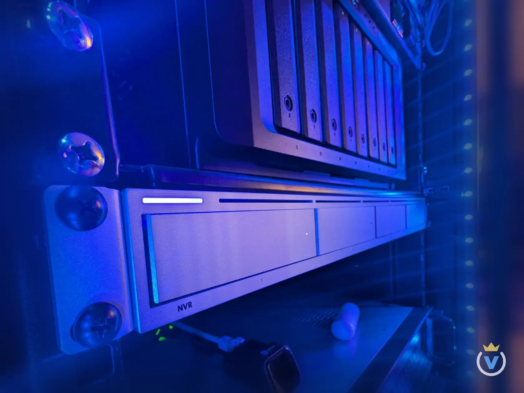 The UniFi UNVR in the rack under the Synology DS1817+, its status bar lit.
