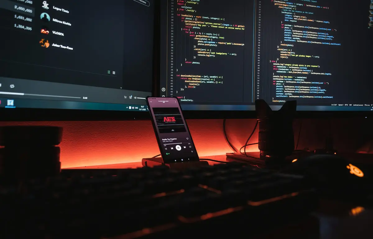 Development workstation with two monitors and a phone
